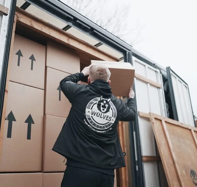 A Wolves Storage Sussex team member loading packed boxes into the van for storage — Wolves Storage Sussex serving Henfield
