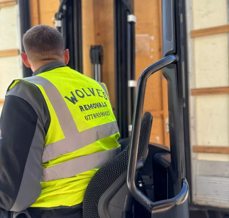 Wolves Storage Sussex operator loading a sealed wooden storage container with a forklift at our secure West Sussex facility