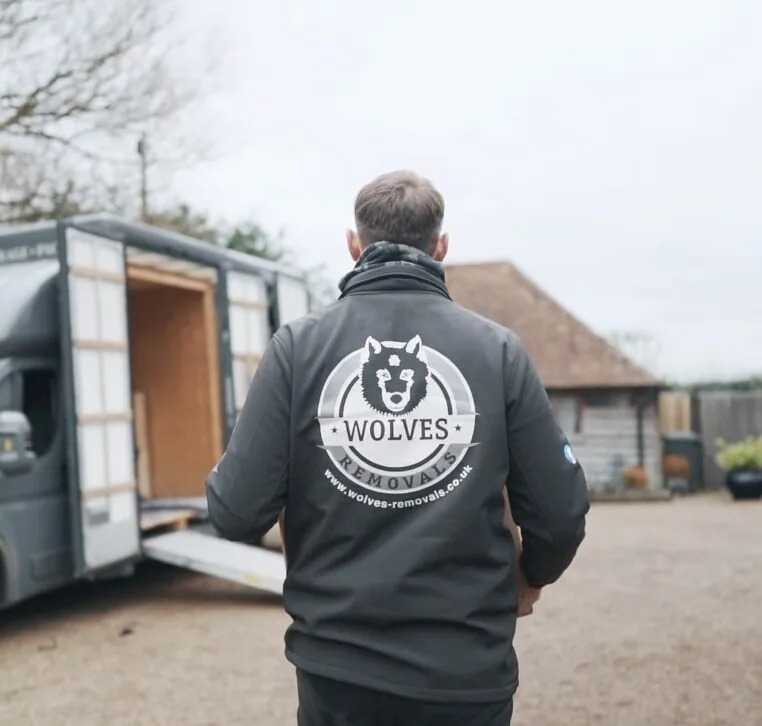 A Wolves Storage Sussex team member loading the Luton van during a door-to-door collection &mdash; serving Washington